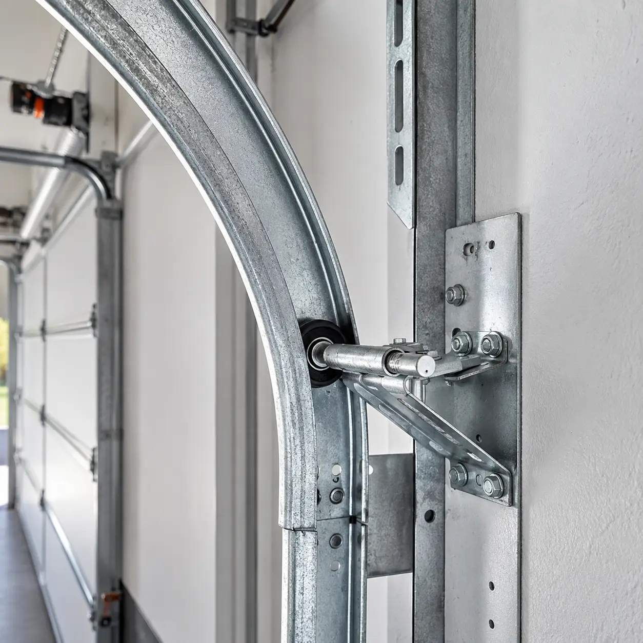 Lawrence Garage Door Pro technician performing track alignment and garage door maintenance
